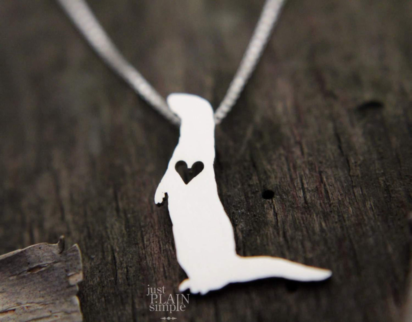 Tiny River Otter necklace, sterling silver pendant